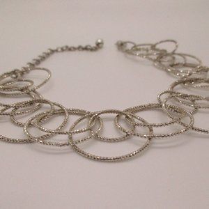 GLITTERING SILVERTONE MULTI CIRCLE 8" BRACELET 3 INCH EXTENDER